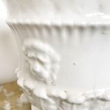 Vintage covered pot in white earthenware molded with lions and friezes
