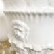 Vintage covered pot in white earthenware molded with lions and friezes