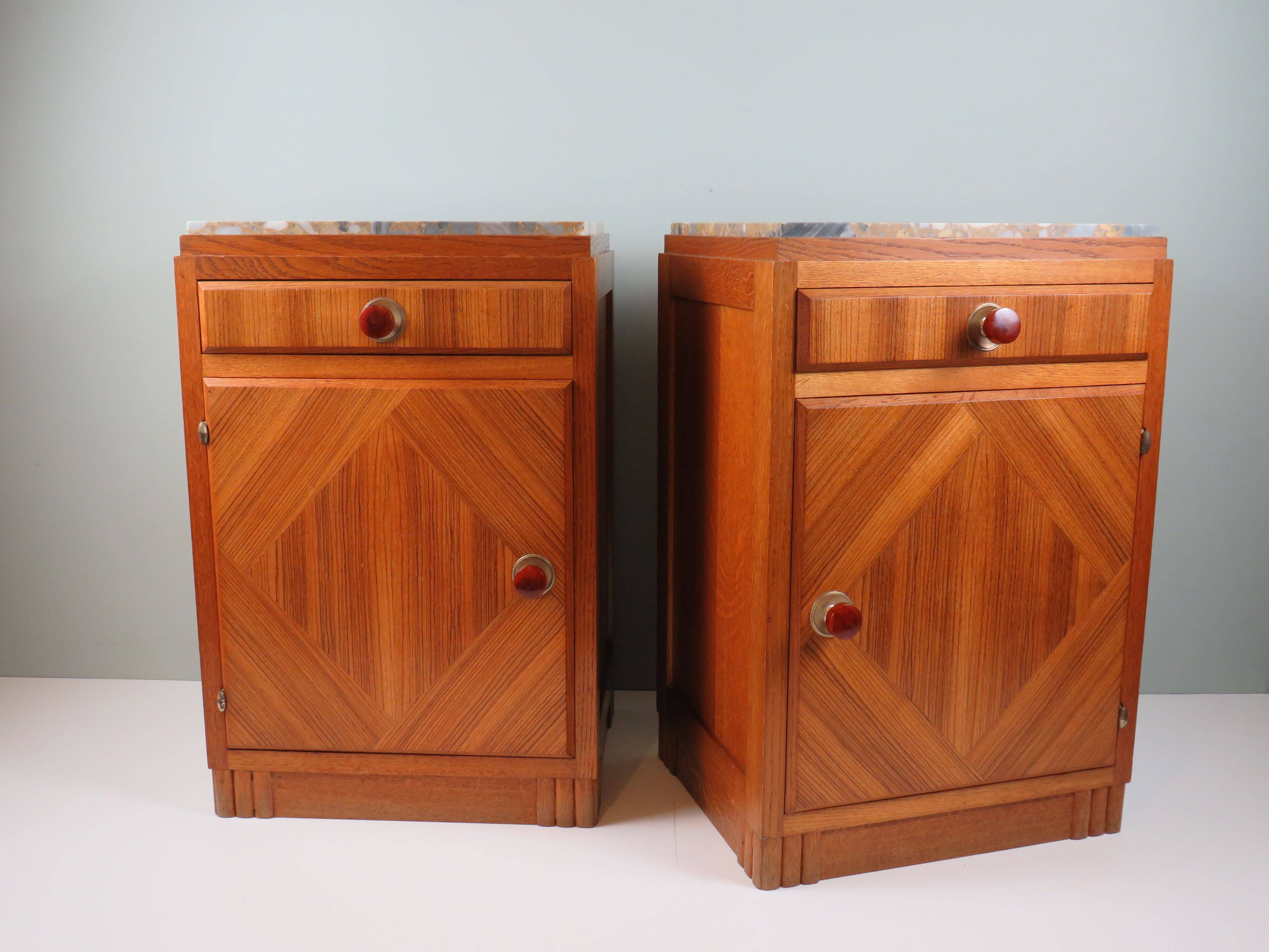 Art Deco bedside tables in oak with an inlaid marble top.