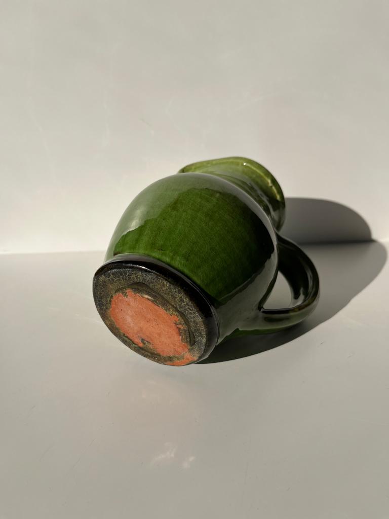 Green glazed ceramic pitcher