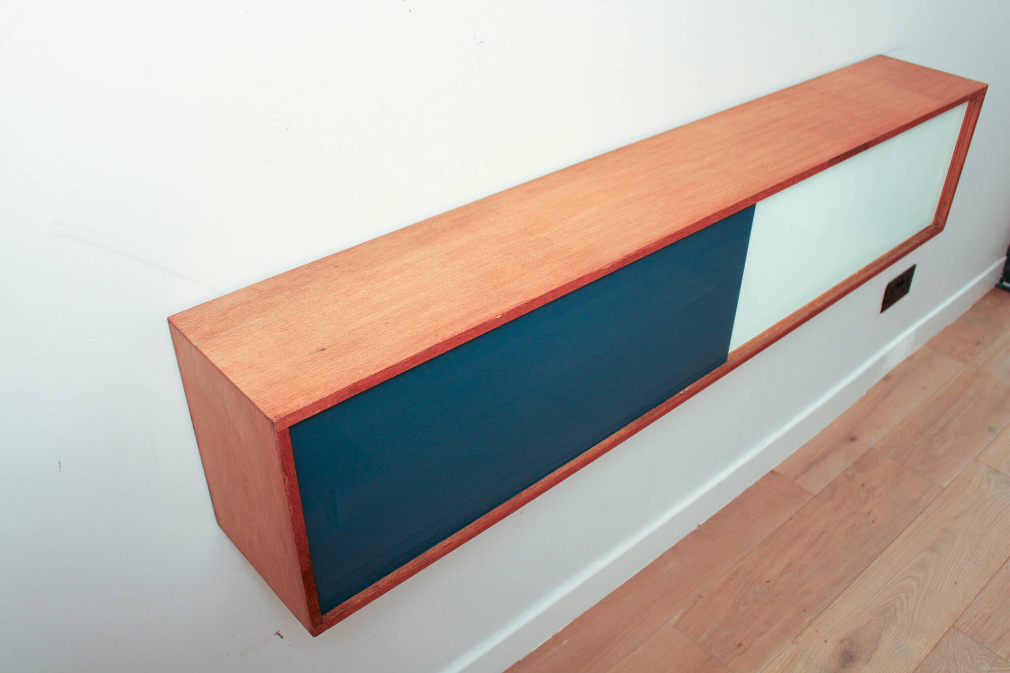 Vintage mid-century wall hung oak cabinets, blue & white sliding glass door