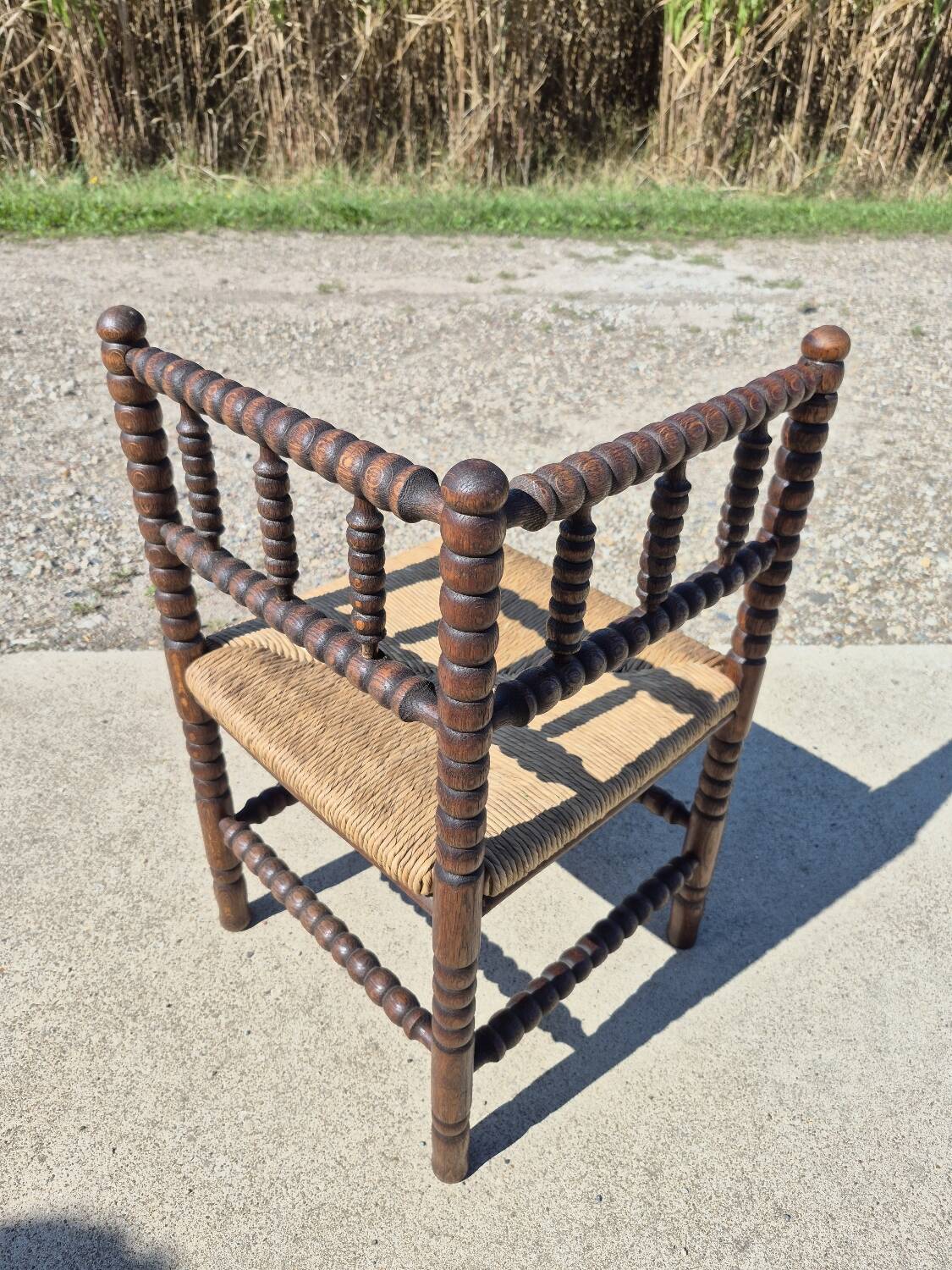 Vintage Dutch rustic corner chair bobbin turned oak with rush seating