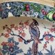 Oval Japanese plate with peacock decoration.