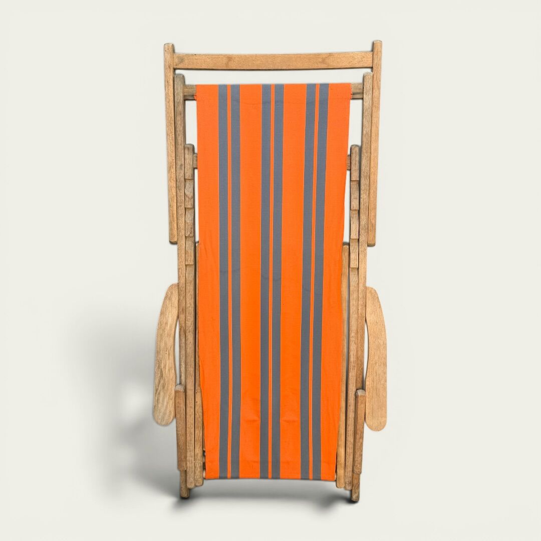 Vintage deck chair with orange and grey striped fabric, original patina.