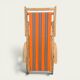 Vintage deck chair with orange and grey striped fabric, original patina.