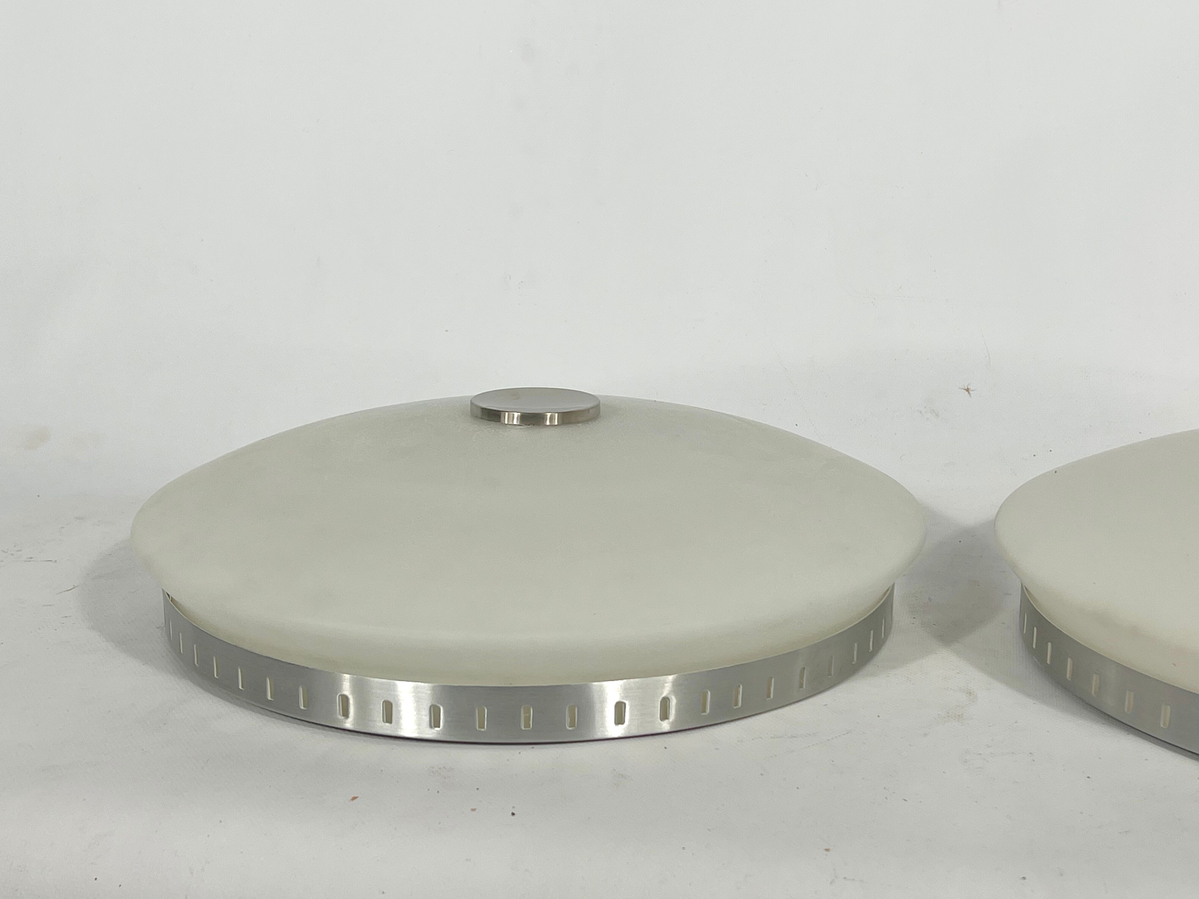 Stilux Milano, pair of round opaline glass ceiling lamps. 1960s