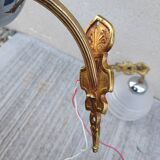 Pair of frosted glass wall lights with brass attachments, circa 1970