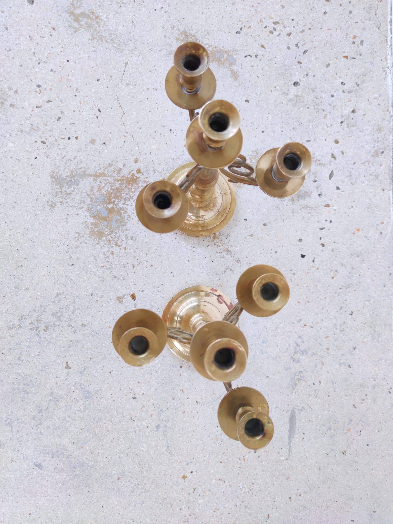 Pair of four-light candle holders in gilded brass