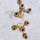 Pair of four-light candle holders in gilded brass