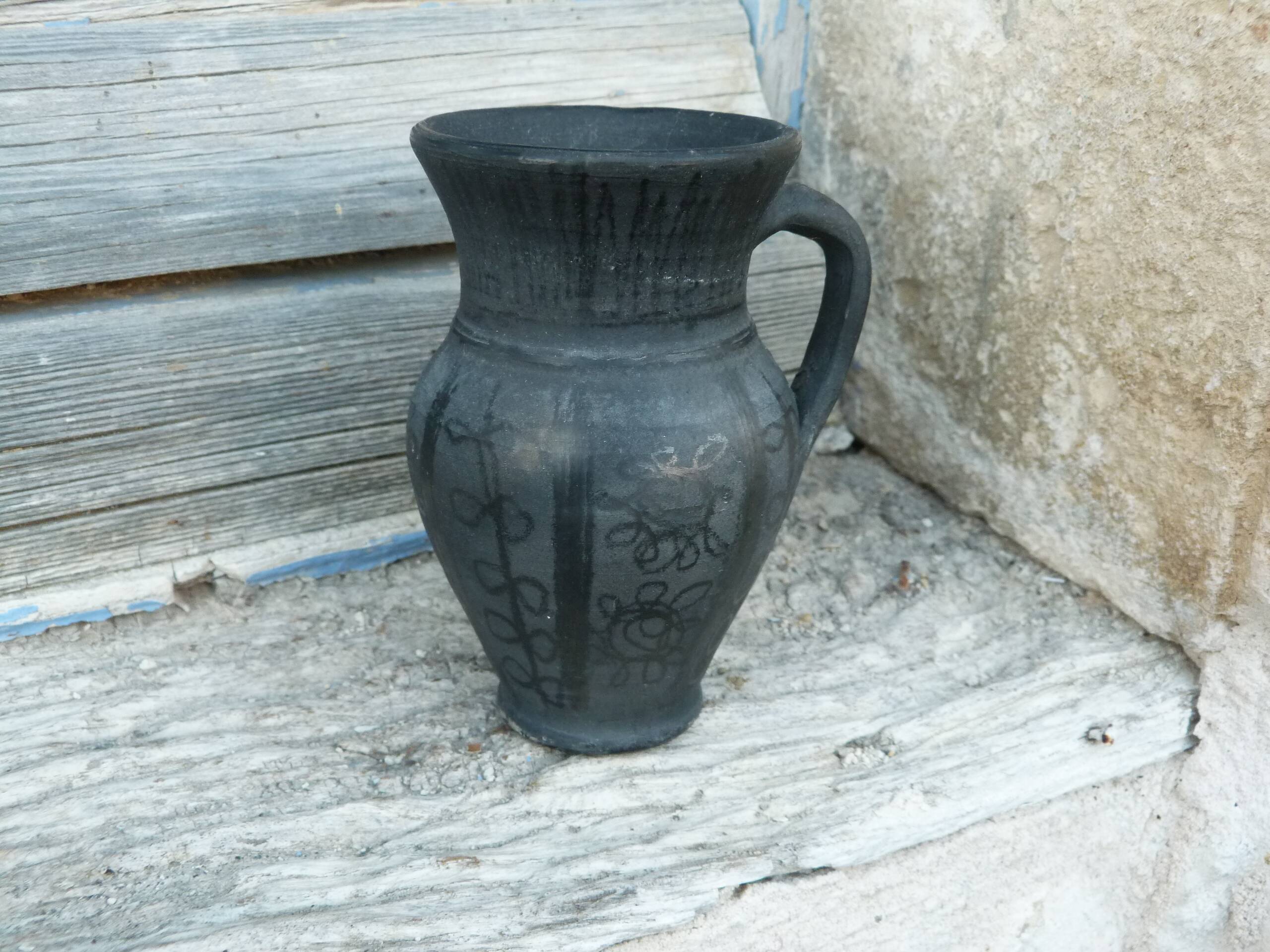 Pitcher in matte and glossy black pottery