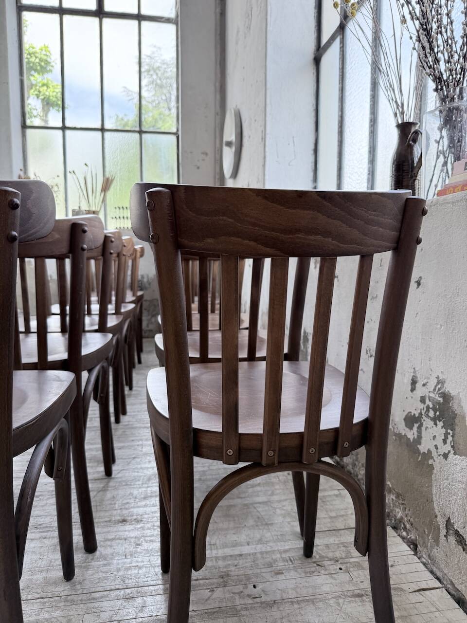 Set of 14 walnut bistro chairs.