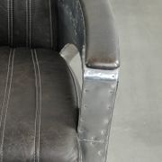 Cow leather aviator design armchair finished with aluminium and rivets