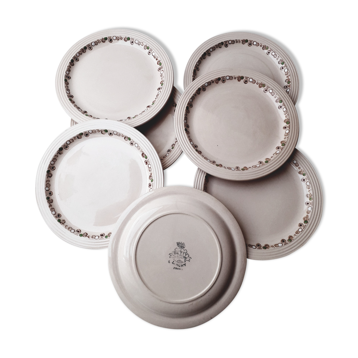 Set of 7 Betty Longwy model plates with floral decoration