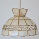 Mother-of-pearl and brass suspension