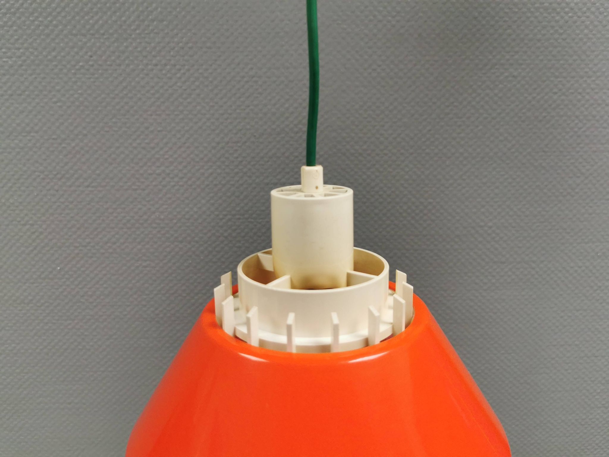 An orange pendant lamp made from hard-pressed ABS plastic. Denmark 1970s
