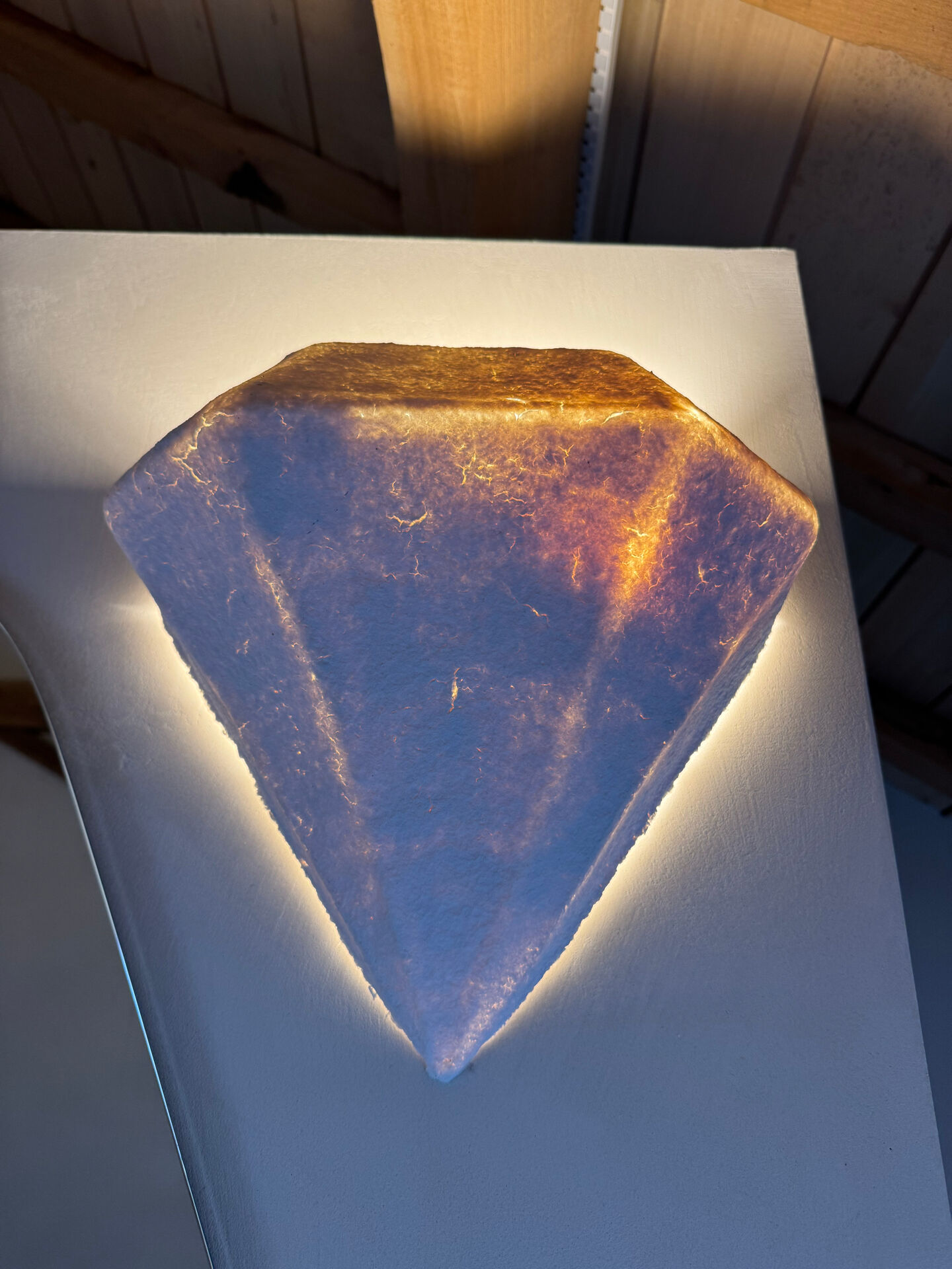Vintage habitat diamond-shaped papier-mâché wall lights.