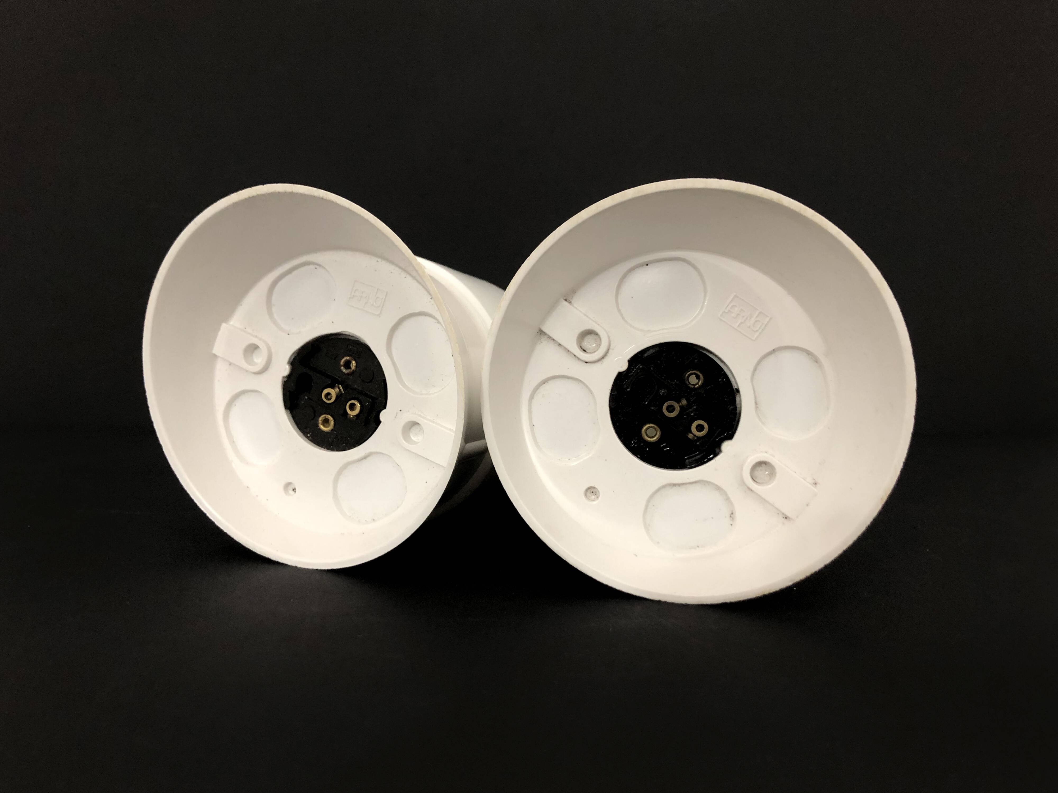 Pair of white oblique wall lights by Arno. 60s