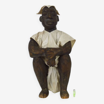 Very large African Dogon statue from Mali, seated dressed man. First half of the 20th century