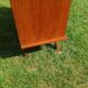 Rattan and wood splayed-leg chest of drawers