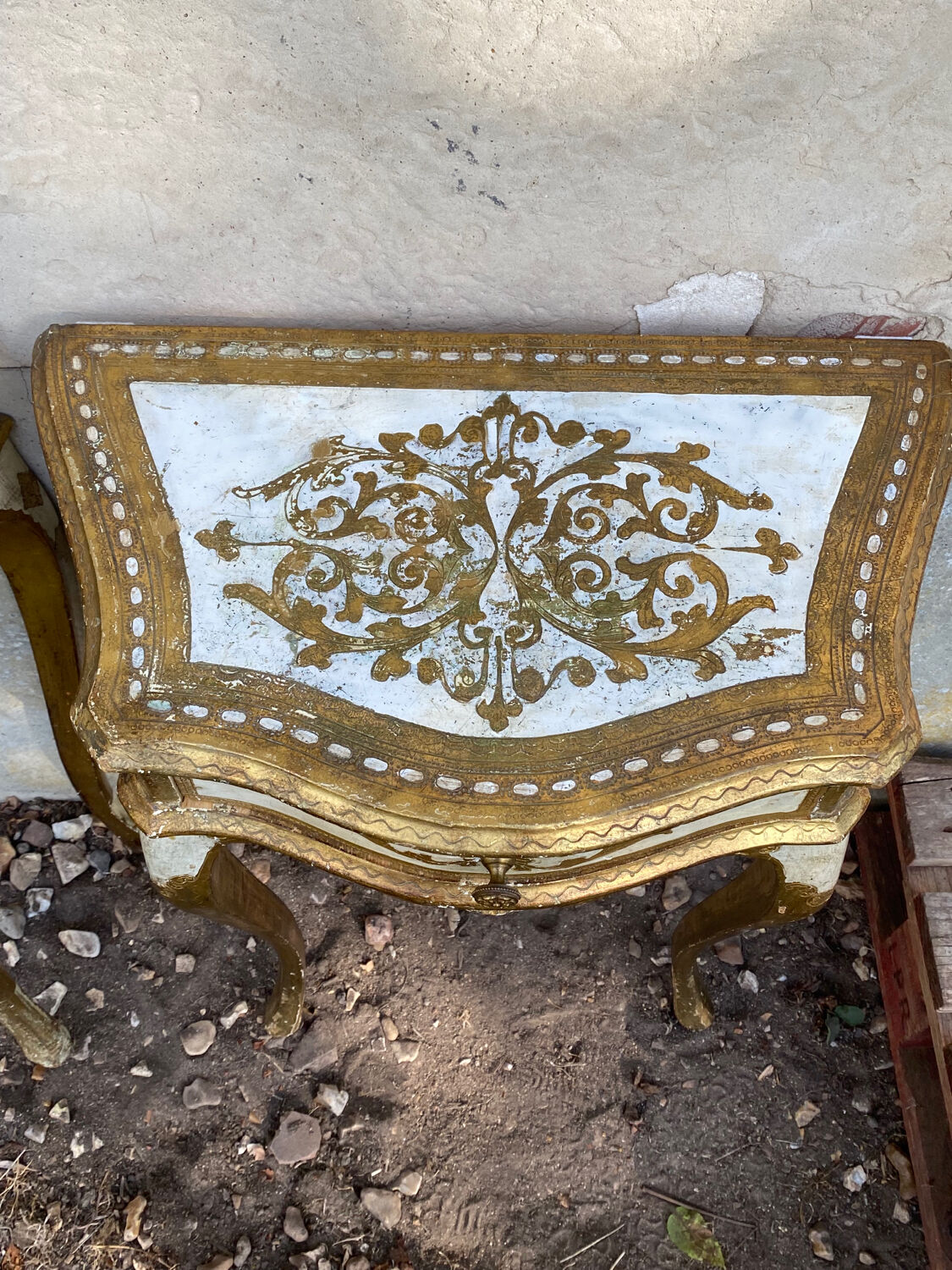 Pairs of Florentine bedside tables in gilded wood.