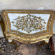 Pairs of Florentine bedside tables in gilded wood.