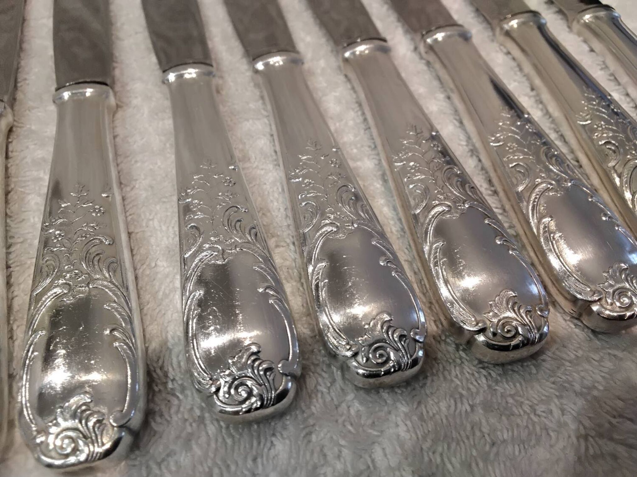 12 silver-plated dessert knives by Platil, rocaille style