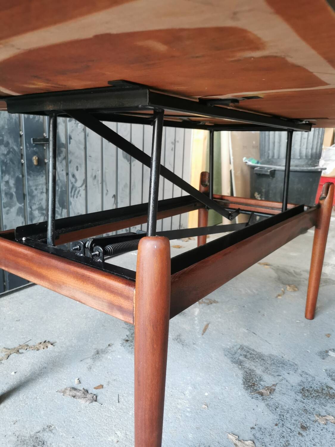 Vintage coffee table with Scandinavian rise and fall system in teak