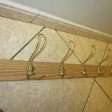 old coat rack with 5 metal hooks