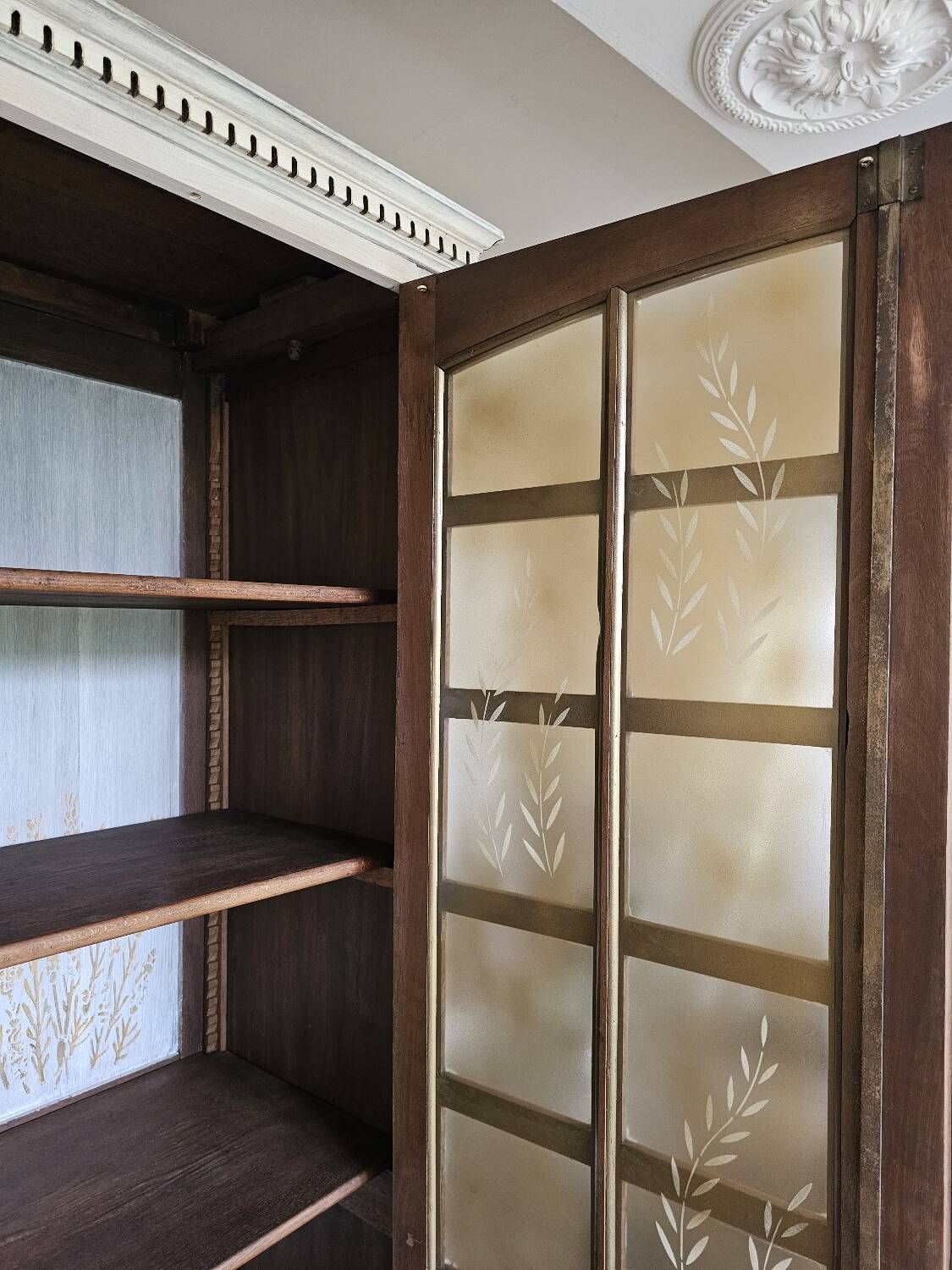 Antique bookcase with a white cerused patina