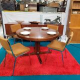 Baumann style round table with integrated extensions from the 70s