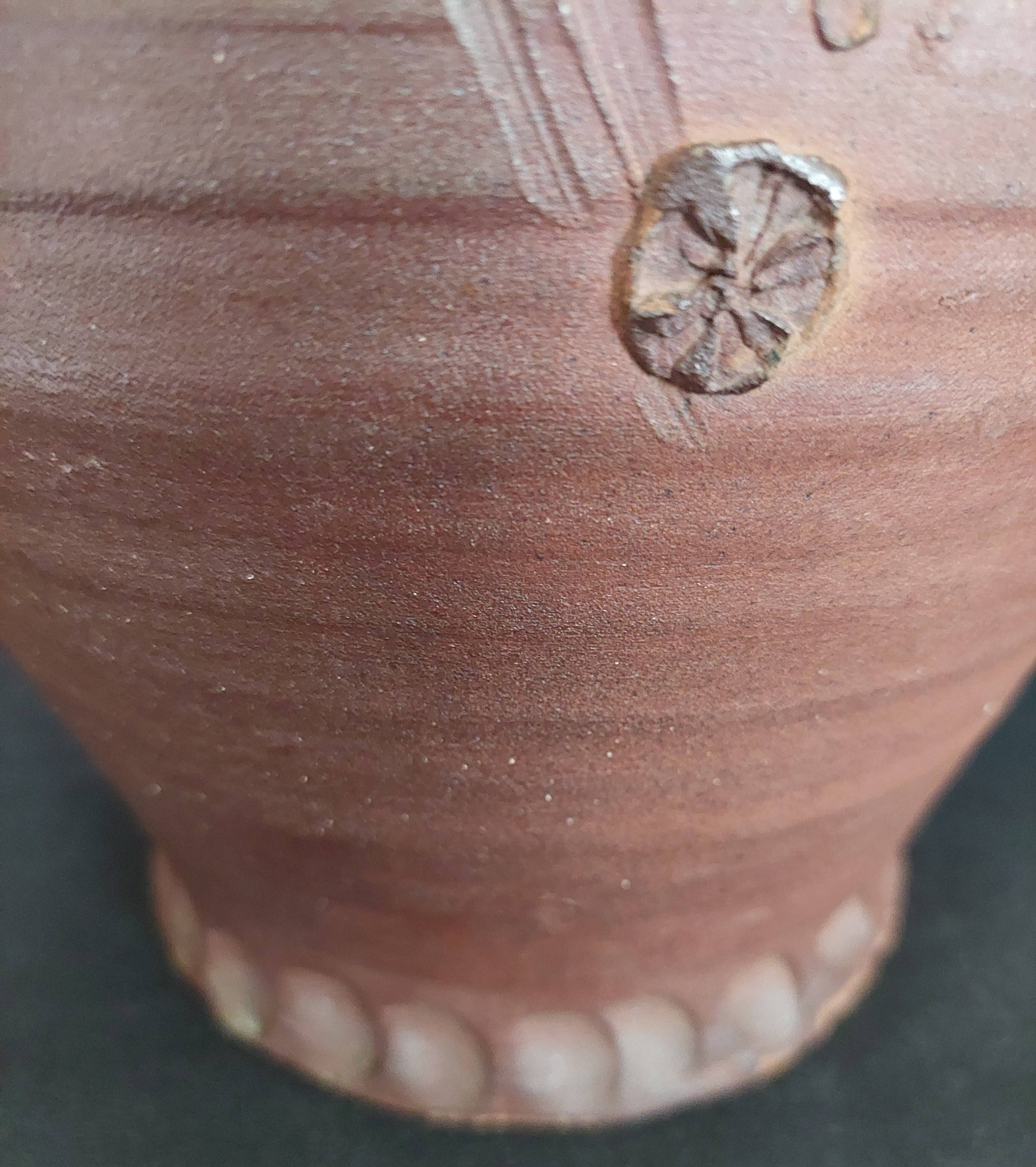 Vintage pitcher with a signature to identify.