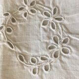 Table service with white handmade embroidery on linen canvas