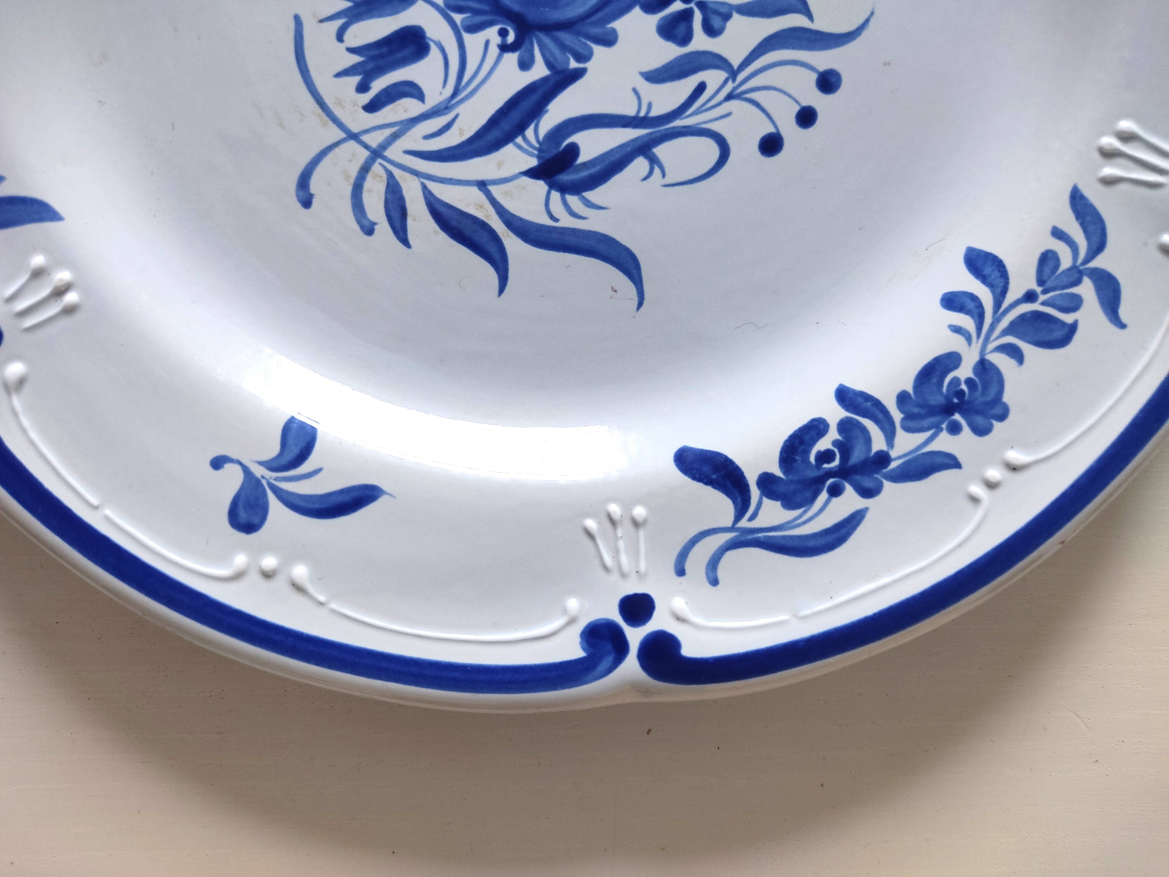 Decorative blue and white earthenware plate