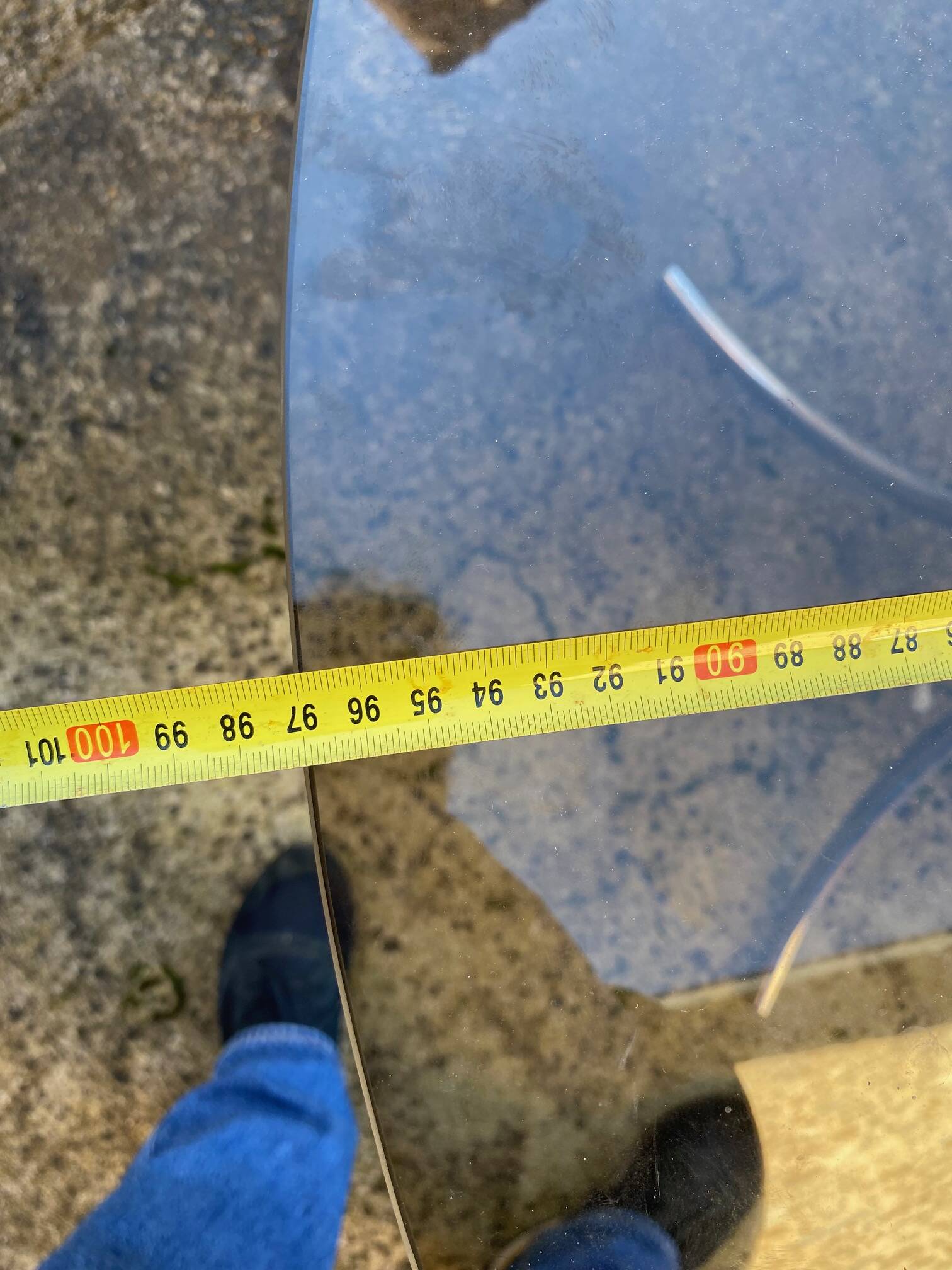 Table with chrome metal legs and smoked glass top.