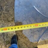 Table with chrome metal legs and smoked glass top.