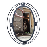 Miroir ovale vintage en fer forgé à décor de spirales