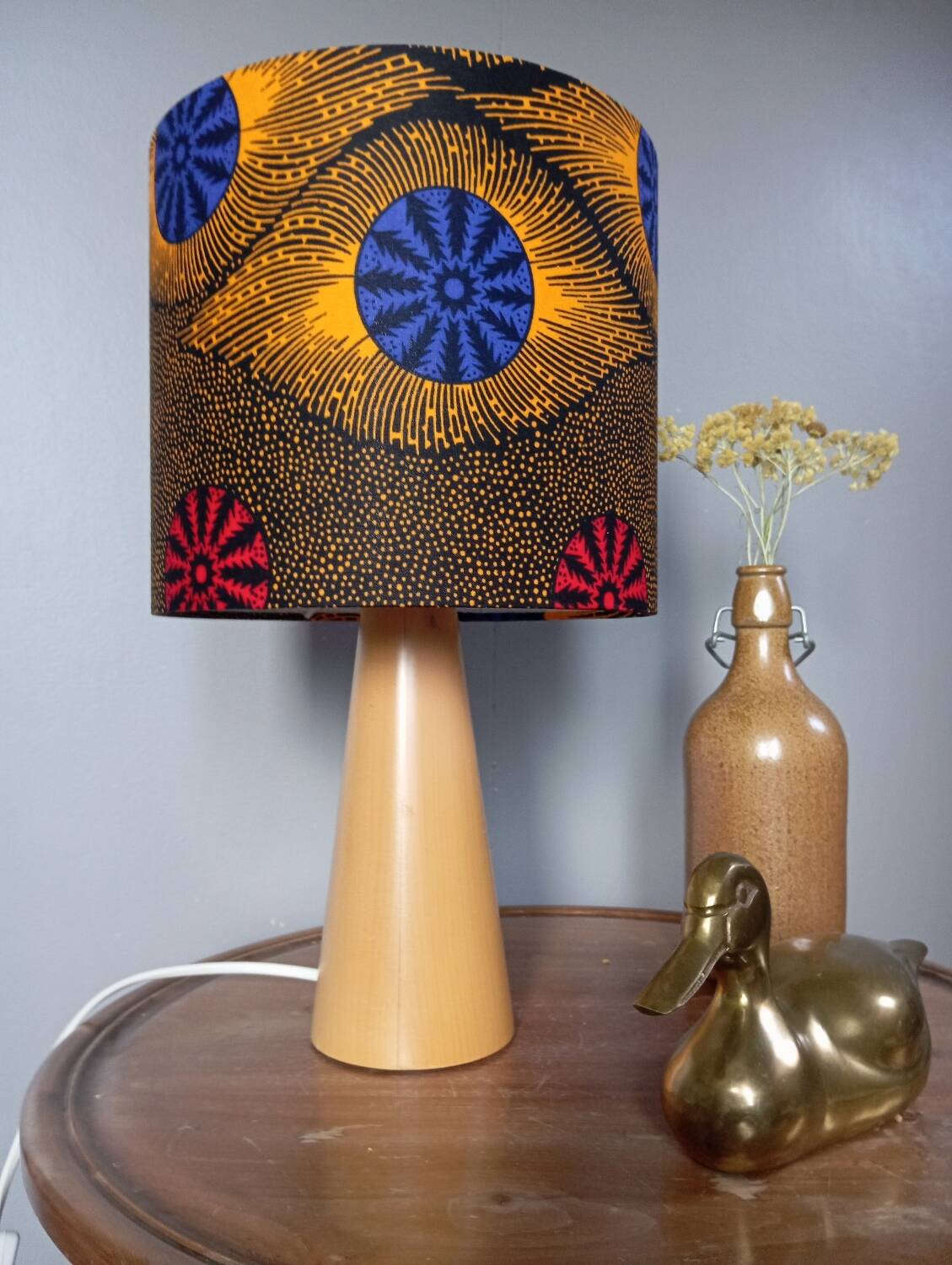 Table lamp in blond wood with handmade wax shade