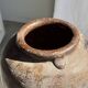 Large traditional Indonesian clay pot featuring a dragon.