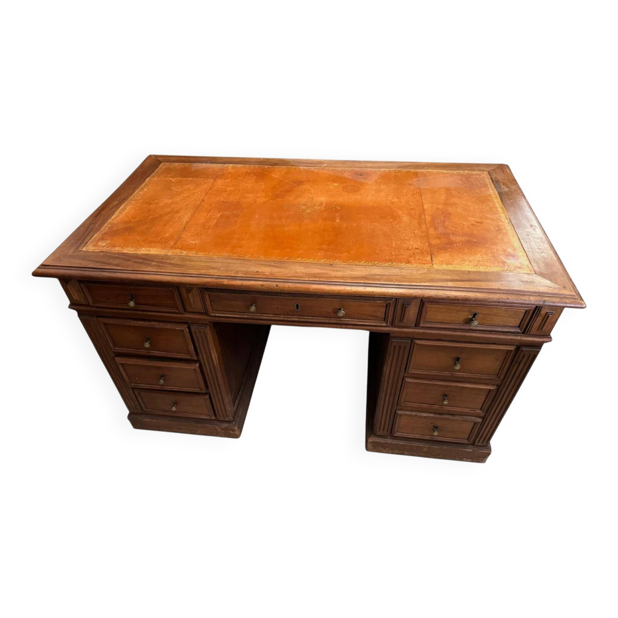 Oak desk with 9 drawers and leather writing pad.