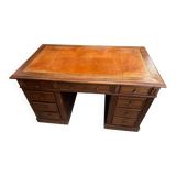 Oak desk with 9 drawers and leather writing pad.
