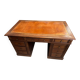 Oak desk with 9 drawers and leather writing pad.