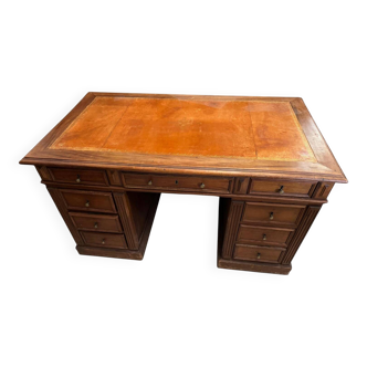 Oak desk with 9 drawers and leather writing pad.