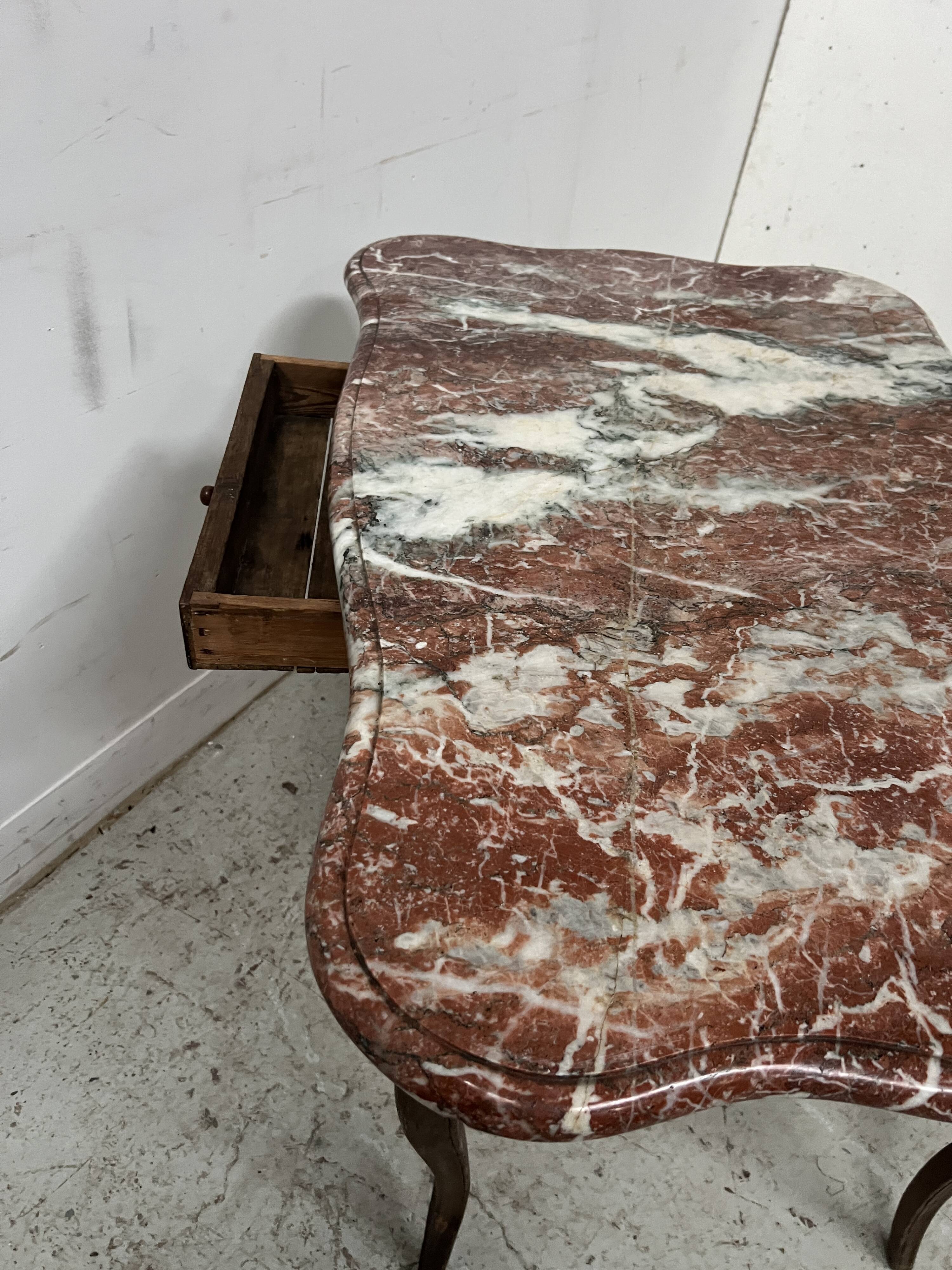 Louis XV mid-table in oak and marble, 18th century.