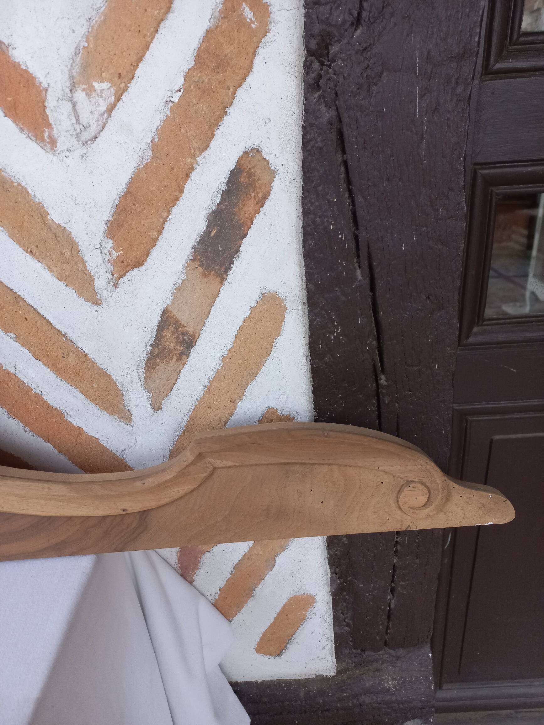 Old sandblasted wooden pediment