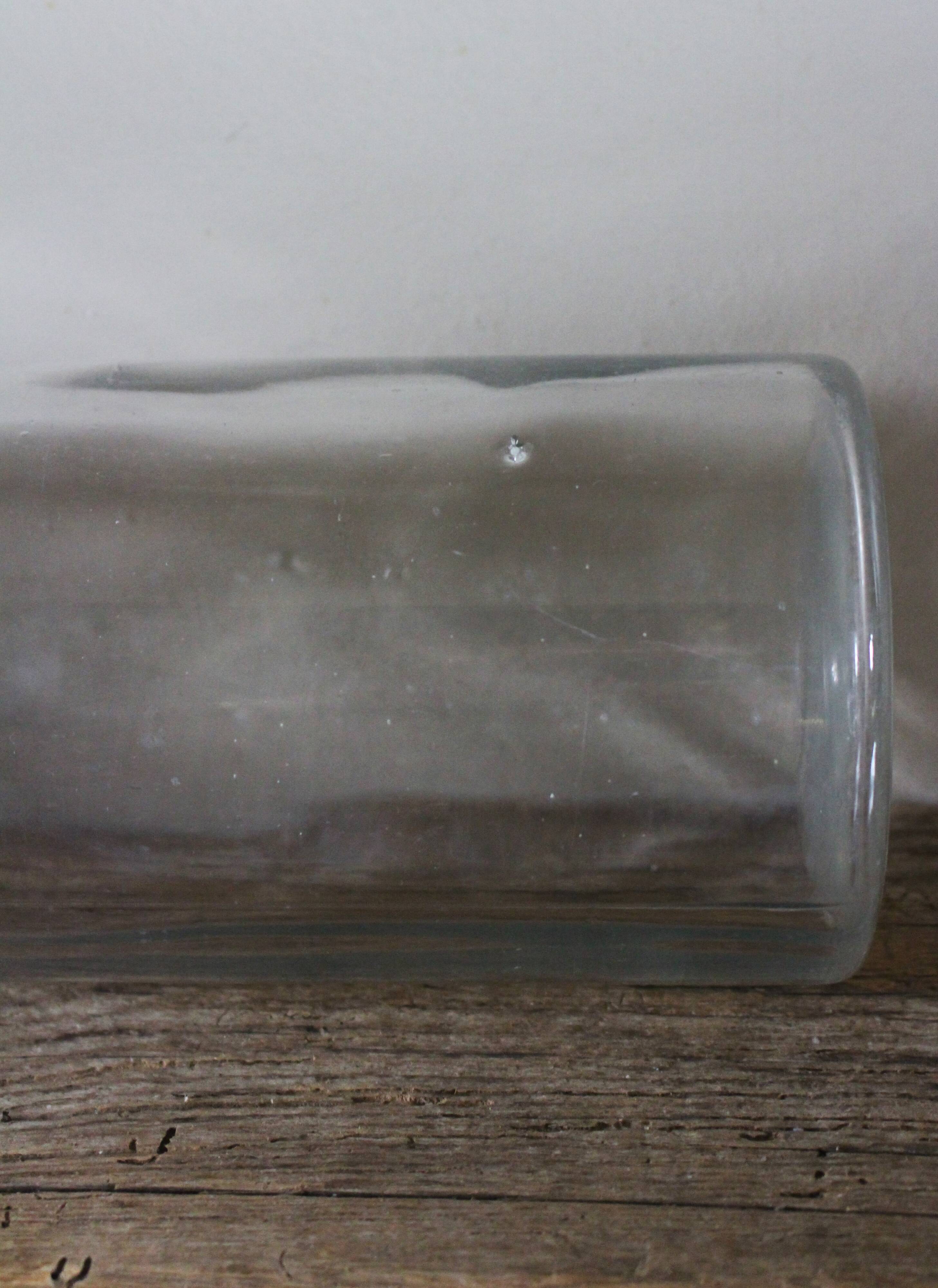 Large antique transparent glass bottle vase