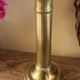 Push-button brass torch candle holder