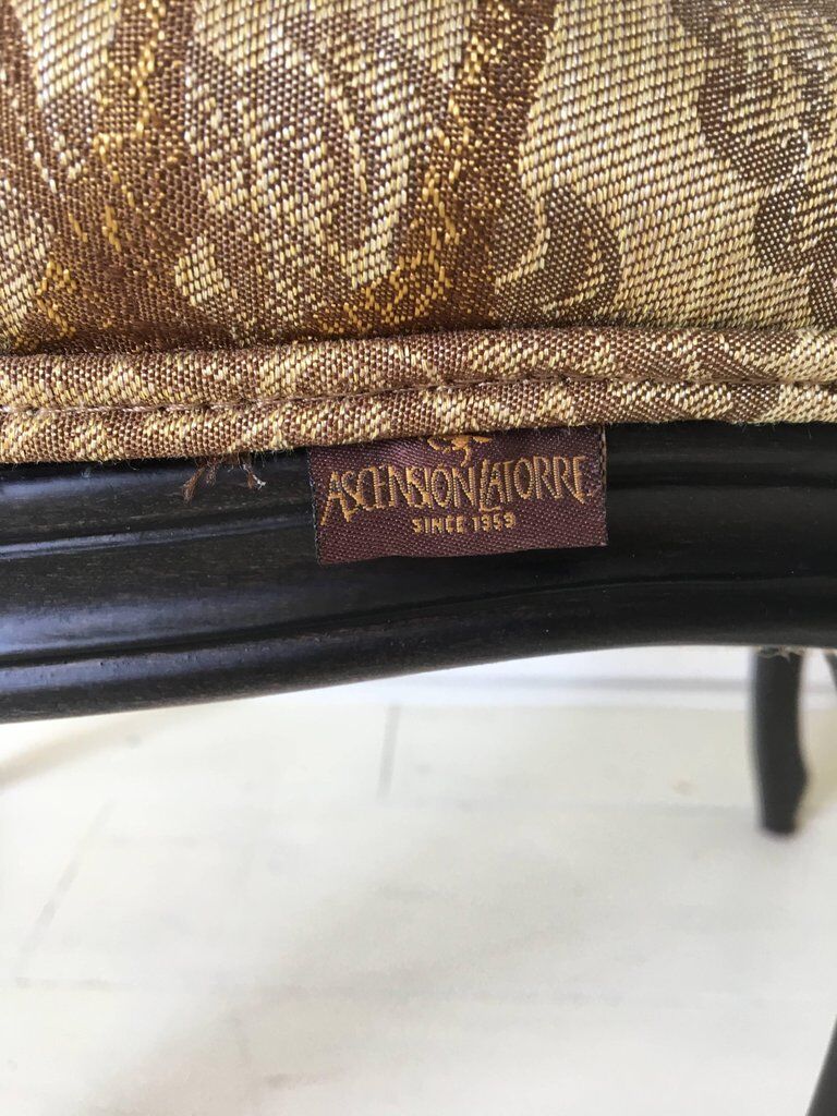 Black baroque armchair with fabric designed by wildlife by Ascension Latorre, Spain