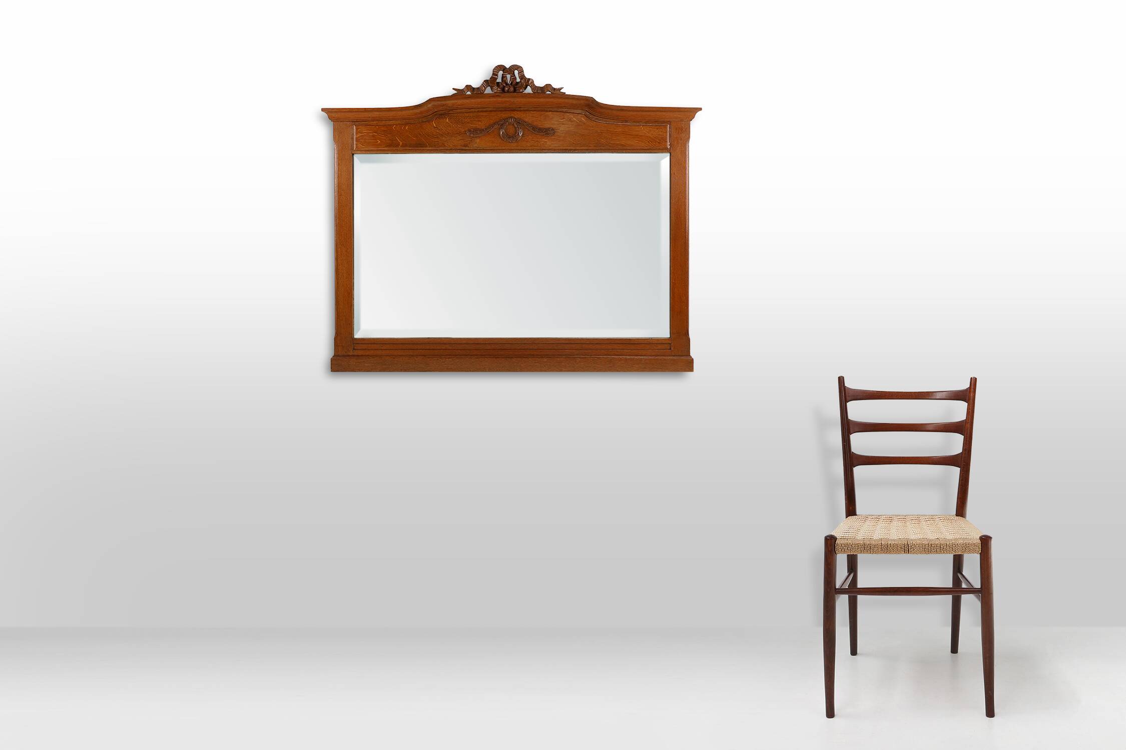 Art Deco mirror in oak with carved decorations and facet cut mirror, 1930s