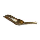 Pelle à thé dorée
