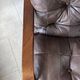 1970s Scandinavian armchair in curved laminated wood with a leather seat.